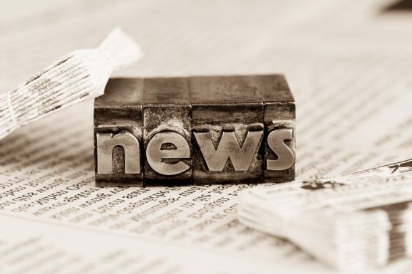 37692941 - the word news written with lead letters. photo icon for newsletters, newspapers and information